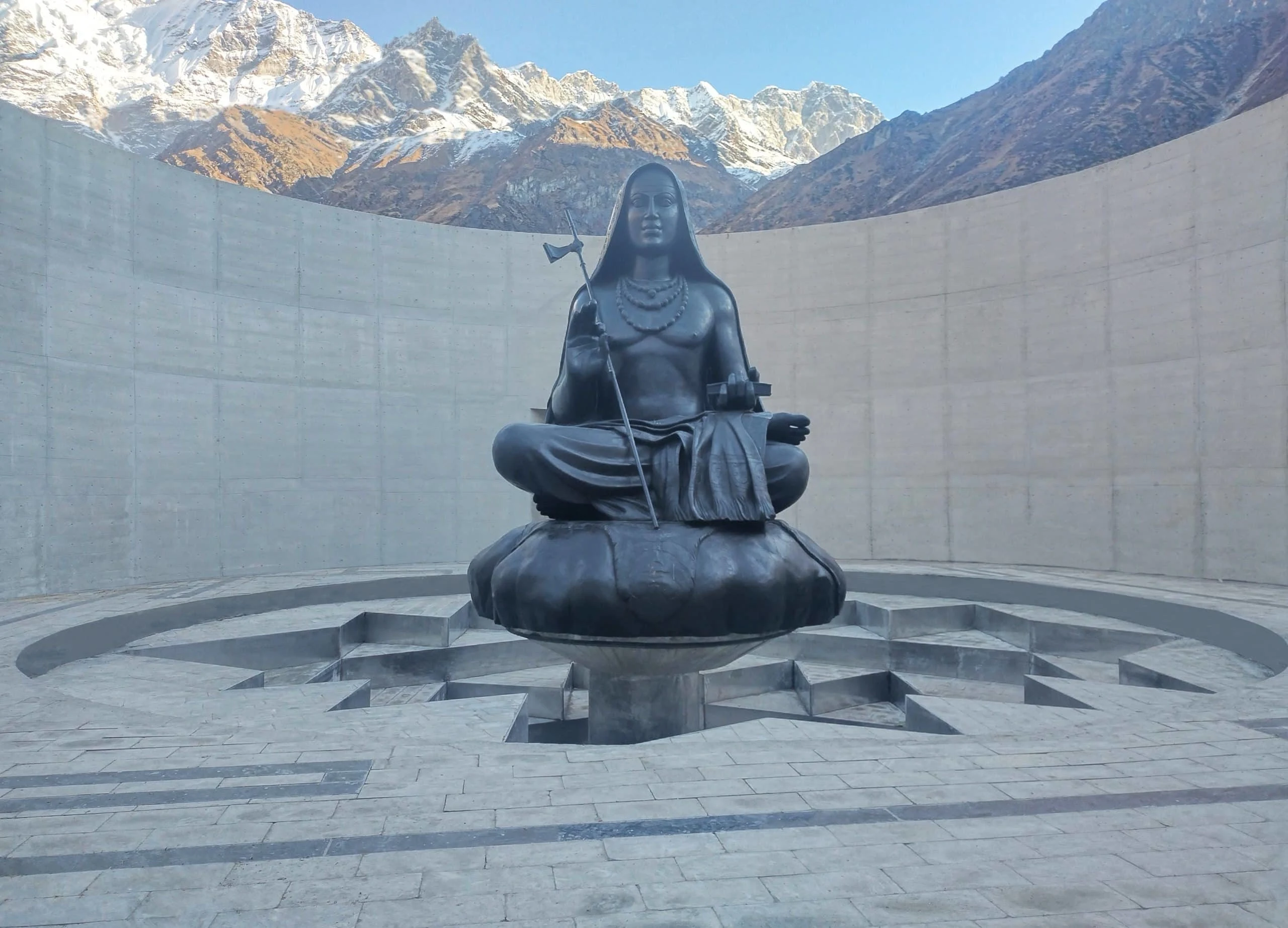 Adi Shankaracharya Statue in the Himalayas with panoramic view and devotees visiting the spiritual landmark